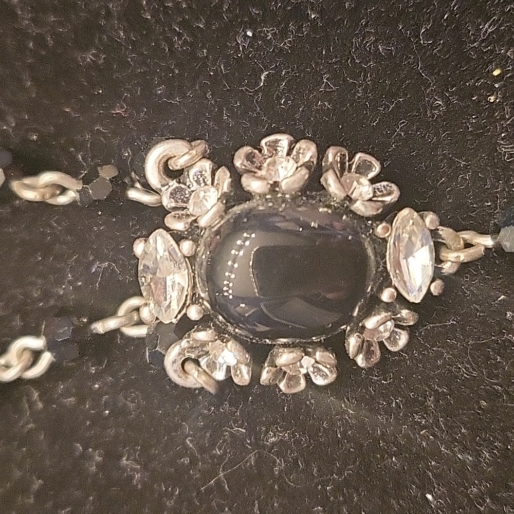 WHBM black and silver extra long rosary style necklace.